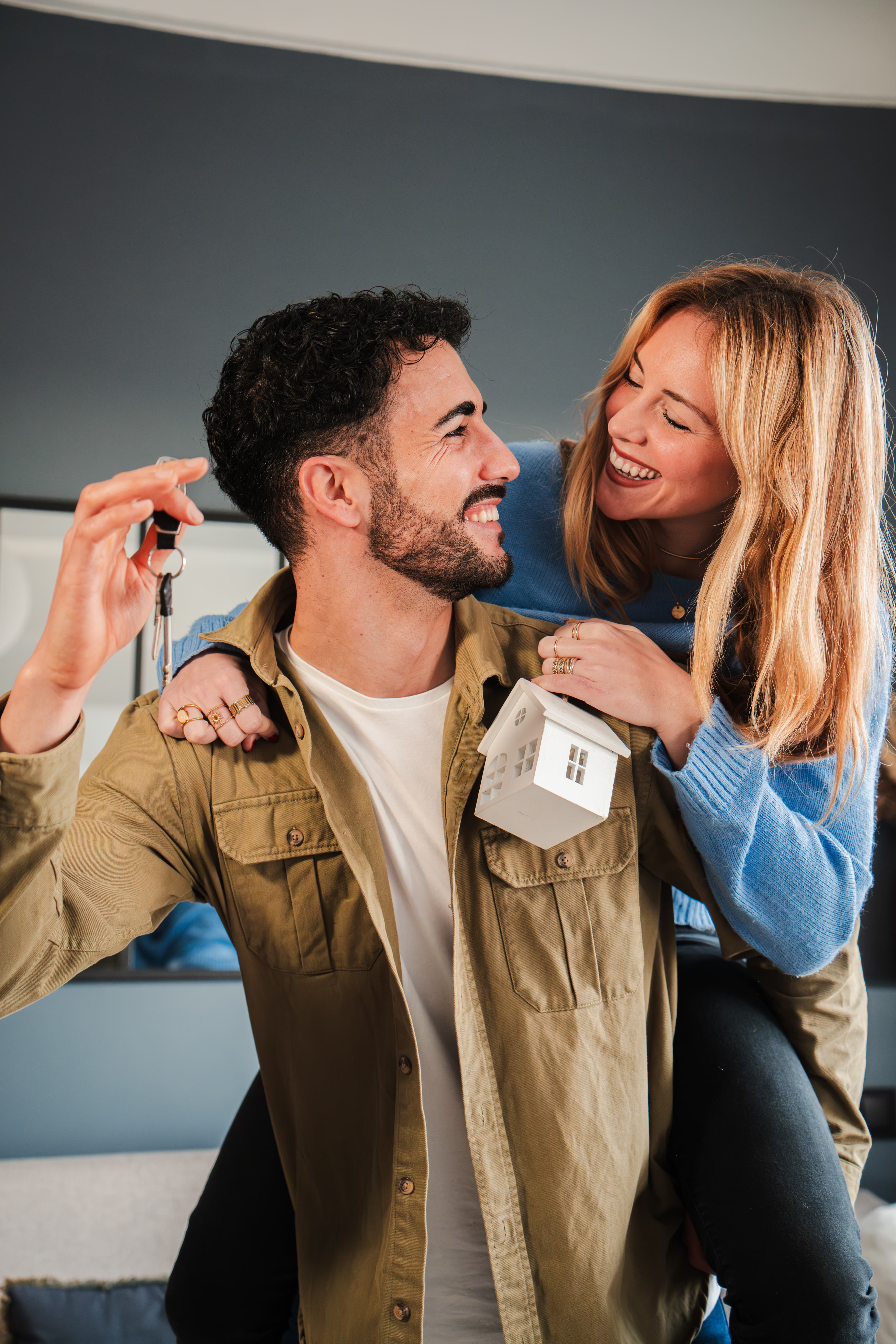 Family in front of their new home